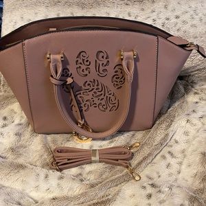 New without tags paw print handbag.